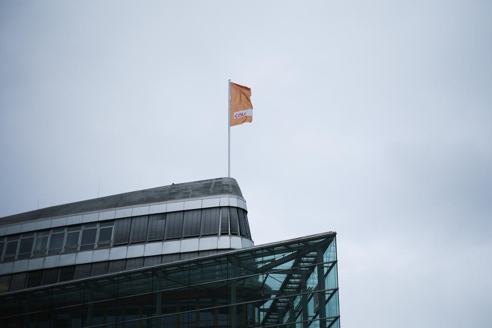 A flag of Germany's Christian Democratic Union party, CDU, the party of Chancellor Angela Merkel, waves in the wind on top of the party's headquarters in Berlin, Germany, March 14, 2021. Markus Schreiber/Pool via REUTERS