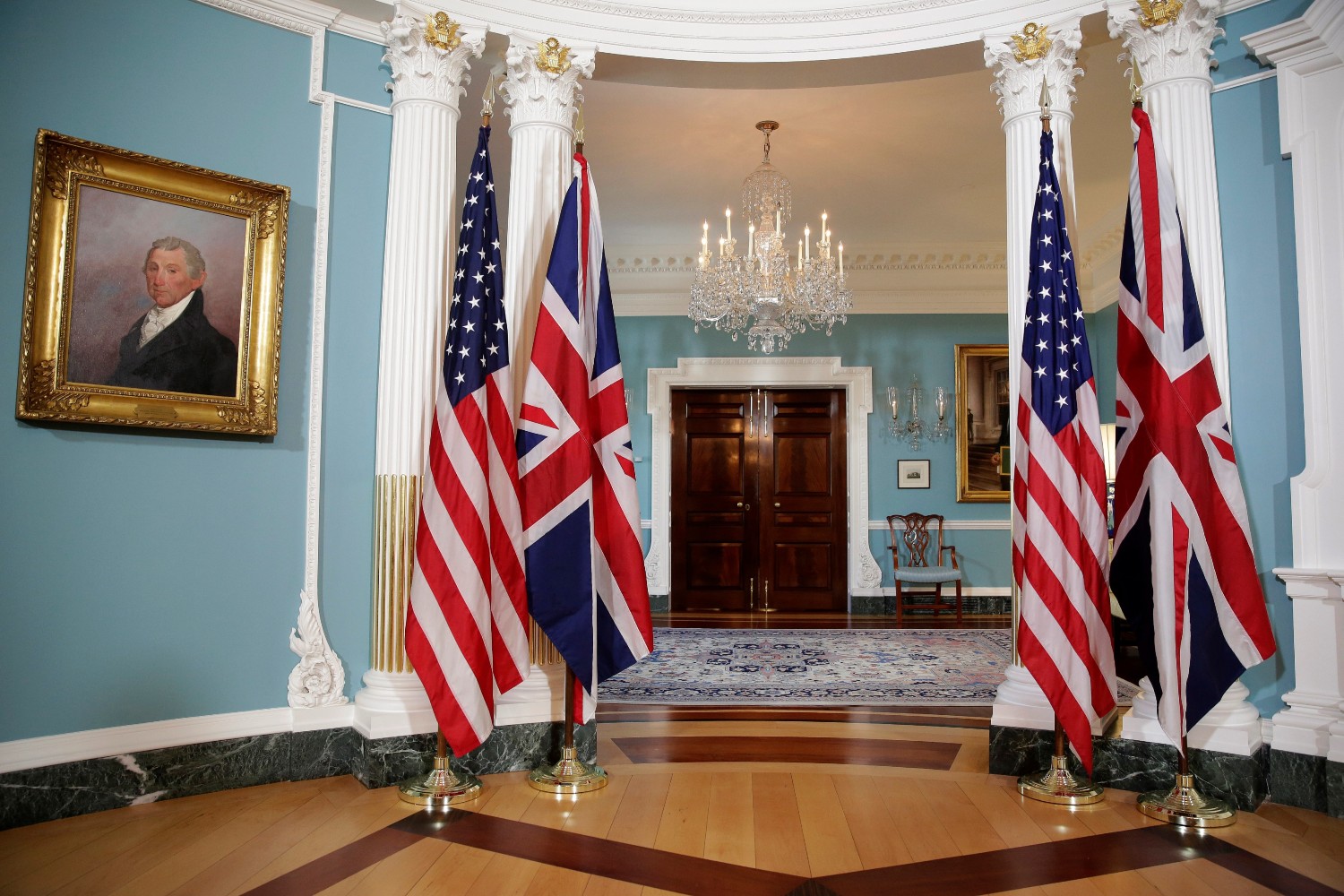 The flags of the United States and the United Kingdom stand after bi-lateral photo between U.S. Secretary of State Rex Tillerson and British Foreign Minister Boris Johnson was cancelled at the State Department in Washington, U.S. March 22, 2017. Reuters/Joshua Roberts