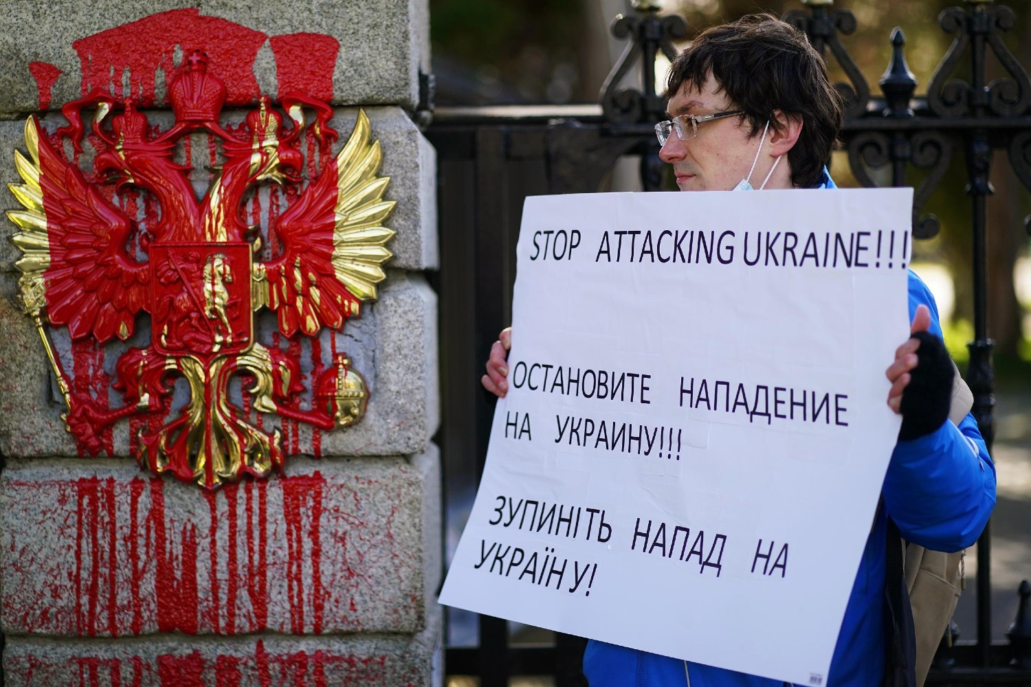 Mykhailo Makarov from Ukraine and living in Dublin protests at the entrance to the Embassy of Russia in Dublin where prior to his arrival red paint was poured on the coat of arms of the Russian Federation following the Russian invasion of Ukraine. Picture date: Thursday February 24, 2022. (Photo by Brian Lawless/PA Images via Getty Images)