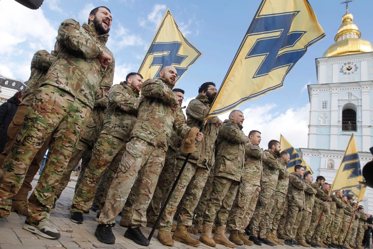 Ukrainian veterans of the Azov Battalion, formed by a white supremacist and banned from receiving U.S. aid, attend a rally in Kyiv on March 14, 2020.Vladimir Sindeyeve / NurPhoto via Getty Images