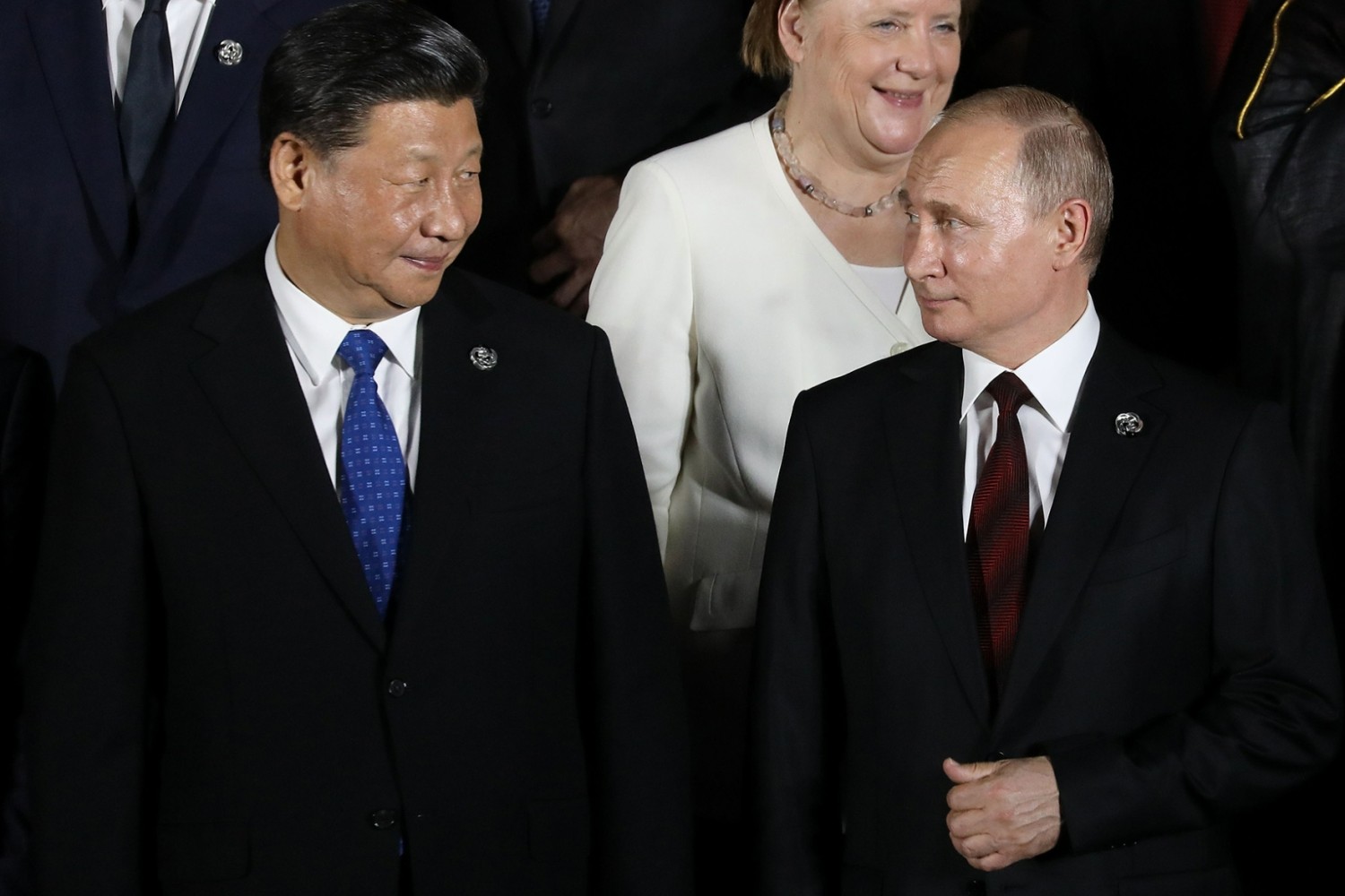 Chinese President Xi Jinping and Russian President Vladimir Putin pose for a group photo during the G-20 summit in Osaka, Japan, on June 28. DOMINIQUE JACOVIDES/AFP/GETTY IMAGES