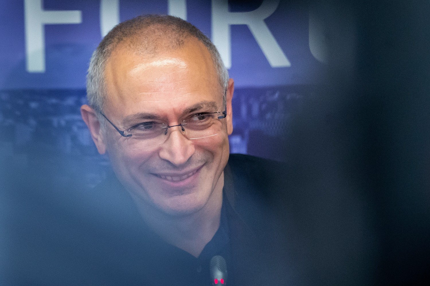 FILE – Russian opposition figure and former owner of the Yukos Oil Company Mikhail Khodorkovsky smiles during a news conference after the Vilnius Russia Forum at the “Esperanza” hotel in Paunguriai village, Trakai district west of the capital Vilnius, Lithuania, on Aug. 20, 2021. The Dutch Supreme Court is ruling Friday, Nov. 5, 2021 in a $50 billion legal battle between Russia and former shareholders of the country’s bankrupted oil giant Yukos. (AP Photo/Mindaugas Kulbis, File)